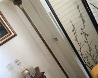 One of two torchier floor lamps