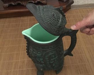 Artifact, not! Pitcher compliments ice bucket