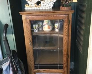 Wood cabinet with leaded glass door