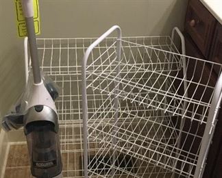 Three vacuums and storage items 