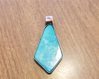 Signed turquoise and silver pendant.  Priced at $65 obo.  You can call/text 785-580-6698 to set an appt to purchase this item.  Thank you!!