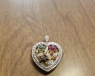 925 gold plated locket with beautiful sto as.  Made in China.  Priced at $45 obo.  You can call or text 785-580-6698 anytime to set an appt for purchase.  Thank you!!