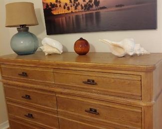 Dresser that matches Queen Head/Foot Board. Artwork, Large Seashells, Lamp, Glass Ball Decoration