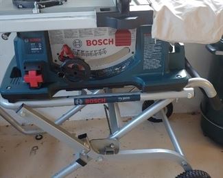 Bosch Foldable Table Saw 2 with x-tra blades.  Like new