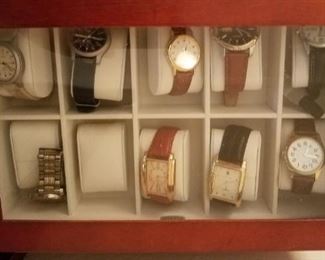 Watch collection and jewelry assortment. 