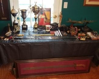 Office full of military / comic hb books / swords / computers and more electronics. 