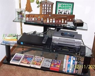 Glass and metal entertainment center, thimble collection, DVD and VHS player