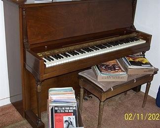 Howard piano, stool and music