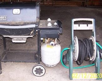 Weber gas grill, hose reel