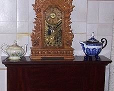 Electric fireplace / heater, oak kitchen clock, tea pots