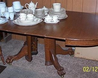 Oak claw foot table w/ 5 leaves and pads, Syracuse china, Monax china and Corelle dish set