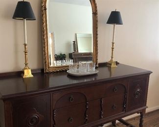 Mahogany buffet/sideboard in excellent condition.  Curved-topped mirror - gold leaf, brass buffet lamps and Waterford - Lismore - highball glasses