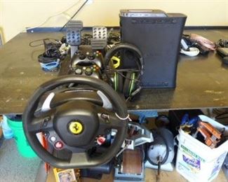 XBOX 360 Ferrari driving game, includes a steering wheel, headset, peddles and game hand controllers.