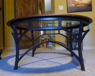 42" round, leather-wrapped wrought iron round coffee table with glass top. 