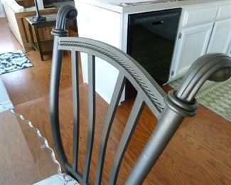 Closer look at the rod iron chair design.