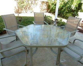 Patio set, One nice glass top table and 6 chairs.