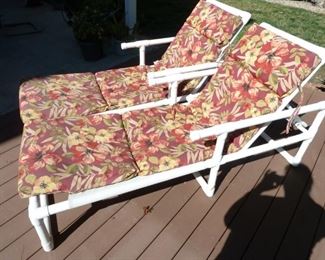 Two lounge chairs with the cushions.