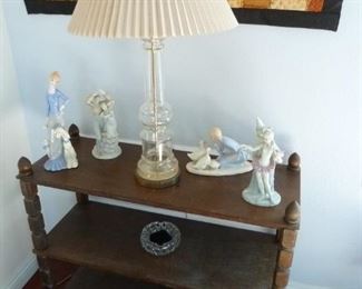 another lamp on a table  with some cute figurines.