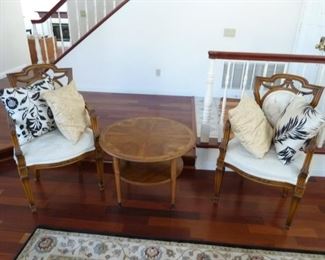 two matching chairs with nice pillows and the mid-century "Lane" round table in the middle.