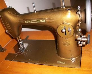 Vintage New Home isewing machine in cabinet