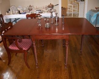 Cherry dining table with tobacco twist legs; the sterling pieces.