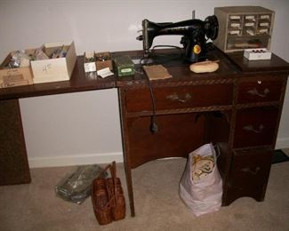 Vintage Singer sewing machine in cabinet