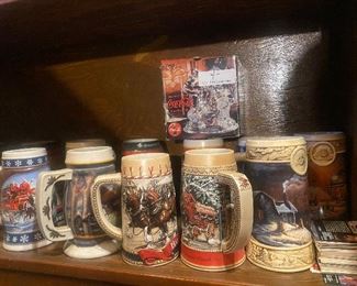 $10./ITEM      COLLECTIBLE BEER STEINS (MOSTLY BUDWEISER AND NUMBERED  ON BOTTOM) (ABOUT 90 LEFT)