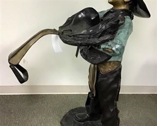 This little cowboy is ready to saddle up. Solid Bronze. 51” tall, 32” deep, 29“ wide