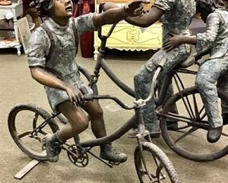 Playful bronze boy pointing to his destination. Solid bronze. Impressive anywhere you place him. 51” tall x 27” wide x 60” long
