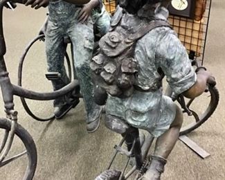 Playful bronze boy pointing to his destination. Solid bronze. Impressive anywhere you place him. 51” tall x 27” wide x 60” long