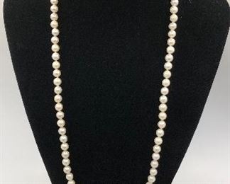 30” Opera length cultured, knotted pearls. 14KT clasp.