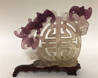Carved amethyst. Chinese. That’s representing happiness and joy along with long life, health, wealth, and virtue.