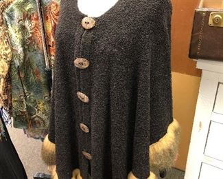 Faux fur trimmed sweater/cape.