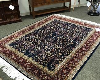 Hereke 6x9 wool and silk Turkish rug.
