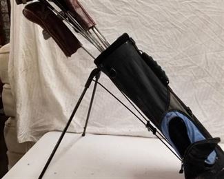 Blue Golf Bag with Clubs and Covers