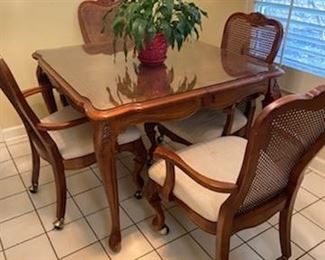 Hooker brand table and chairs on casters.