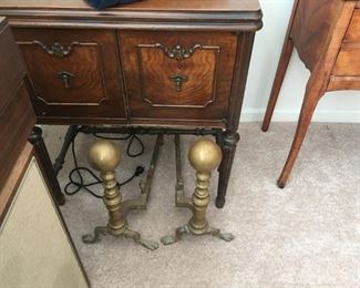 Two items here -- the first is an old Singer sewing machine -- YES, this beautiful cabinet is home to a Singer. The second is a pair of beautiful andirons from a vintage Detroit neighborhood (St. Aubin Street to be exact!)