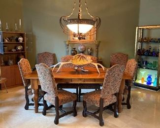 Blenko glass
Mid Century book case
Herman Miller plywood chairs
Eames
Elk antlers
Table 8 chairs