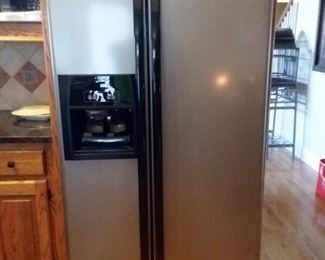 Whirlpool side by side refrigerator with water & ice dispenser