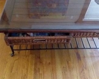 Glass top coffee table with wicker and 2 drawers and lower shelf with matching end table
