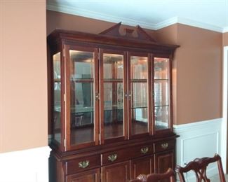 Stunning dining room table with pedestal base & 6 chairs and leaves and China Cabinet/breakfront lighted 