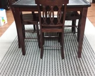 Counter height table with four chairs
