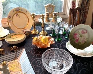 Vintage painted plates, glass pedestal cake plate, vintage wine glasses with green stems, beautiful cut glass bowl, brass candlesticks