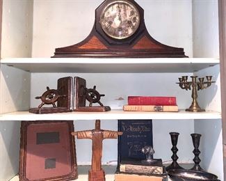 Vintage mantle clock, ships wheel bookends, wooden cross of Jesus, cast-iron dog head paperweight