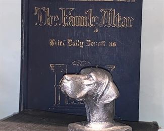 Vintage family altar book and cast-iron dog head paperweight