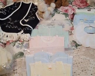 Baby dresses, crocheted spread