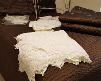 Double bed, metal vanity chair, crocheted bedspread