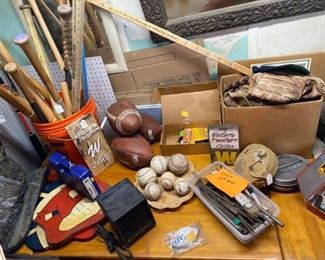sports equipment, baseball bats, gloves, balls