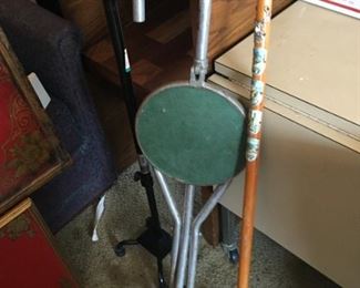 Folding chair and walking stick.
