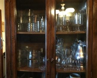 China cabinet with glassware and china.